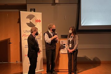 Gordon, Howard and moderator on stage